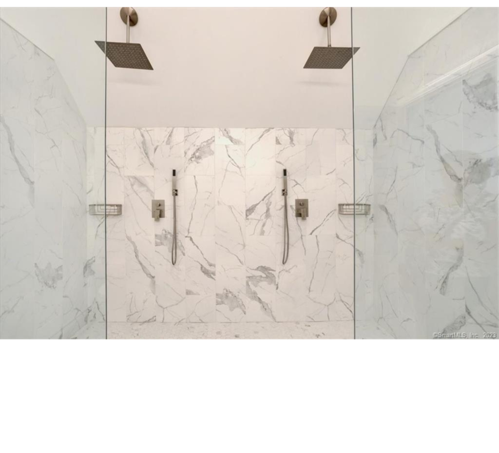Modern Marble Retreat: Dual Glass Showers with Sleek White Walls