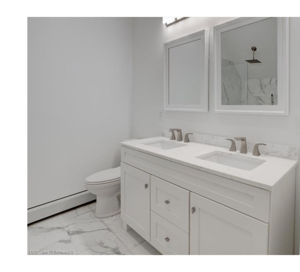 Sleek Serenity: All-White Bathroom with Marble Elegance & Silver Accents