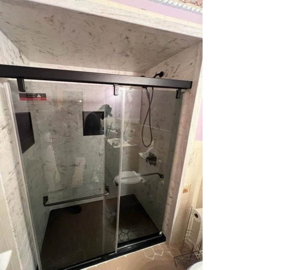 Earthy Elegance: Marble Brown Walls, Black Hardware & Glass Shower Perfection