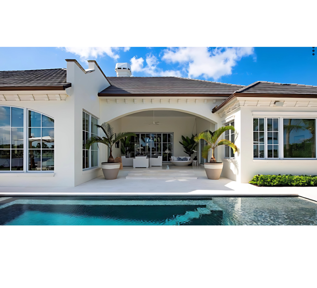 Charming Escape: Open Living, Poolside Seating, White Exterior & Arched Windows