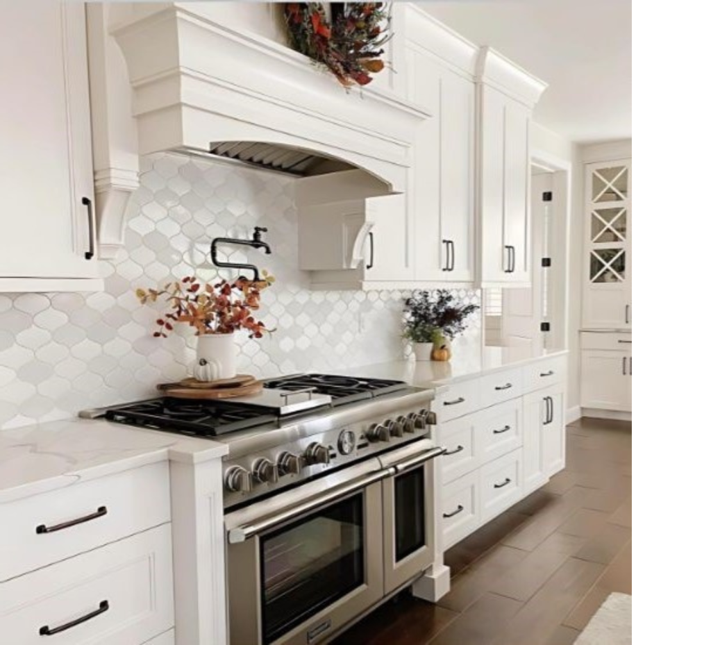 Bright & Polished Kitchen: White Luxury Cabinets, Marble Counters & Textured Wall