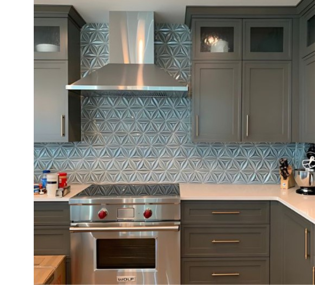 Chic Contrast Kitchen: Dark Gray Cabinets, Silver Accents & Textured Wall Detail