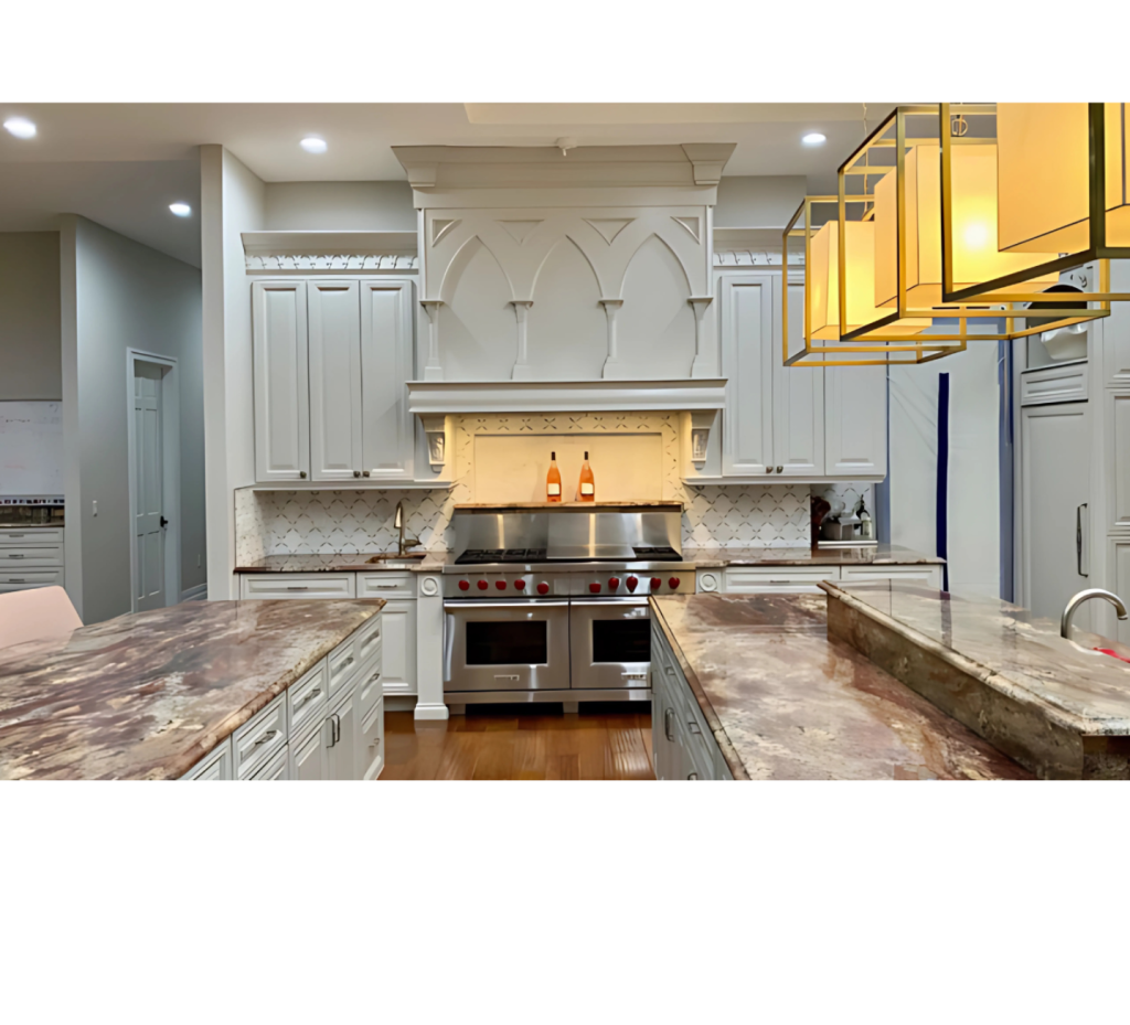 Sophisticated Kitchen: Brown Beige Marble Countertops, White Cabinets & Gold Light Fixtures