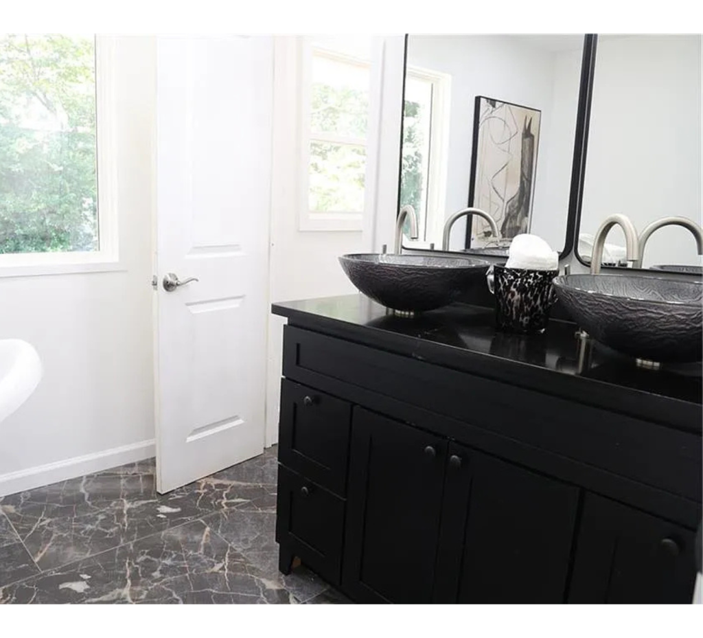 Bold & Modern Bathroom: Black Sink, Dual Mirrors & Striking Marble Floors
