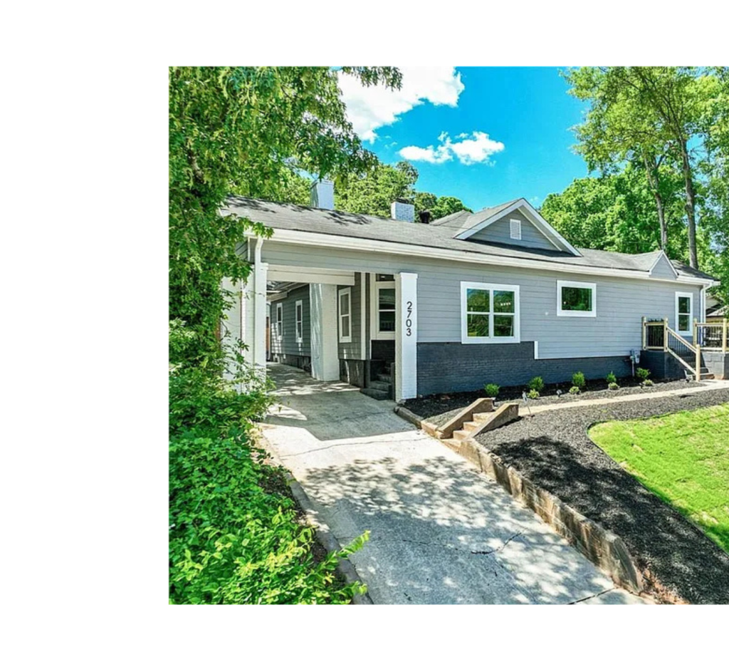 Sophisticated Contrast: Gray Panel Siding, Dark Brick Base, & Bright White Posts for Stunning Curb Appeal