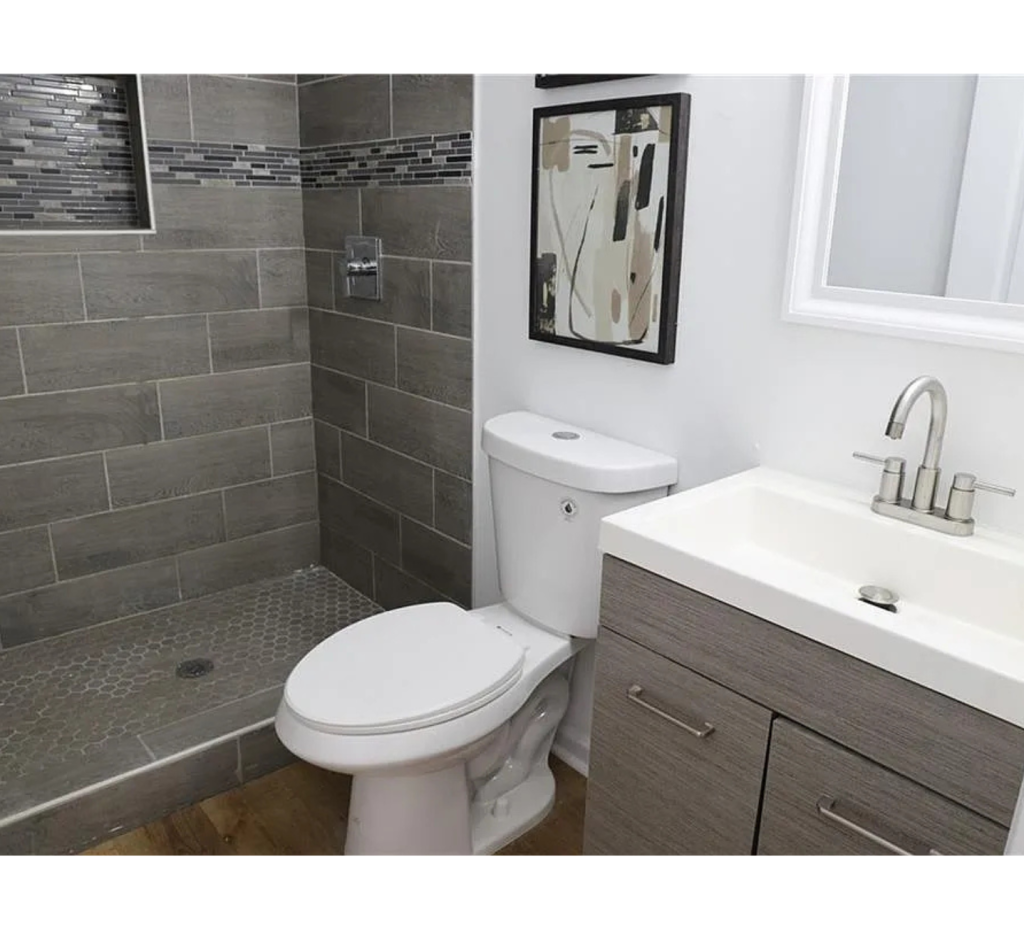 Chic Simplicity: White Mirror & Bowl with Cozy Brown Shower Area