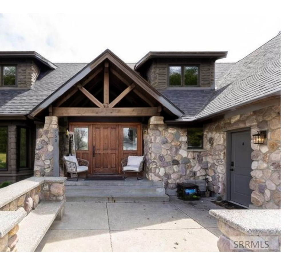 Stunning and Rugged: Bold Rock Exterior Walls & Brown Roof Create a Strong, Inviting Home