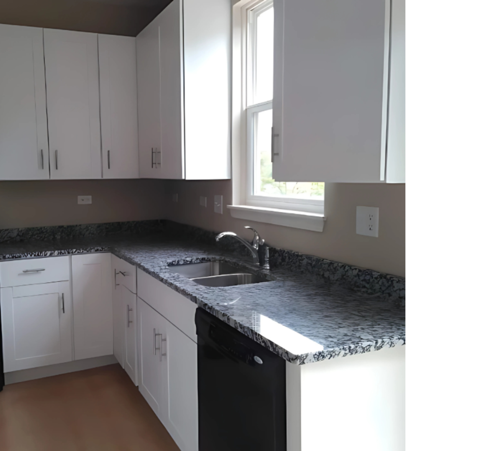 Elegant Kitchen with White Cabinets, Sleek Silver Hardware & Bold Batic Black Tile Accents