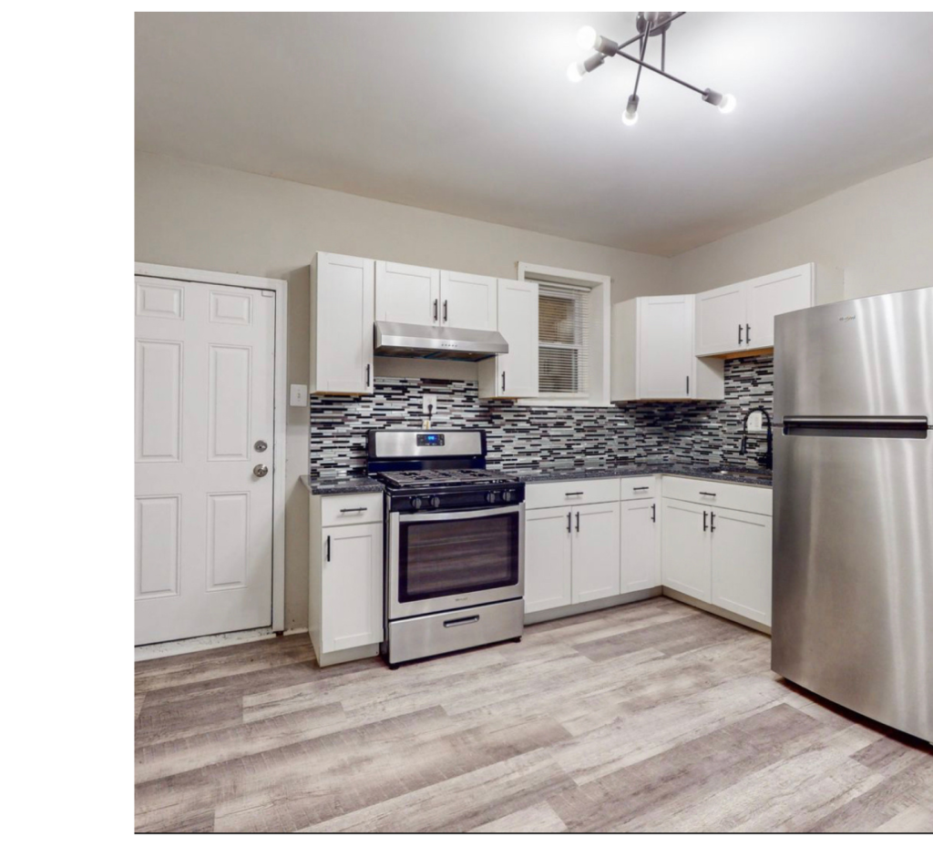 Modern White Kitchen: Bold Backsplash & Stainless Steel