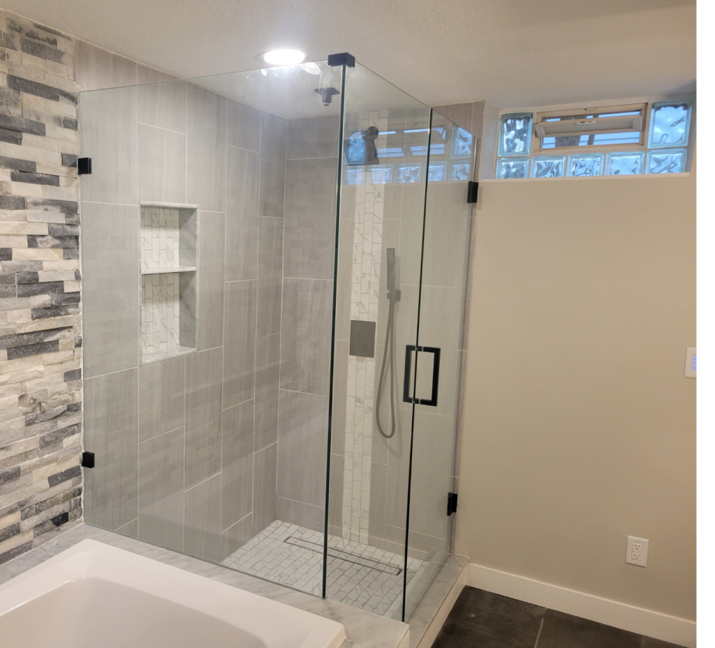 Sleek Glass & Textured Stone: A Modern Shower Sanctuary