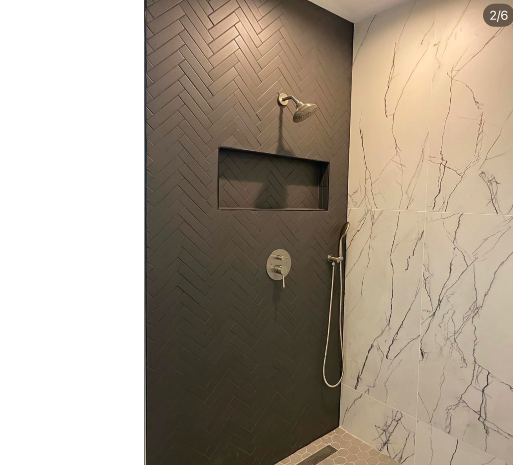 Dramatic Herringbone & Elegant Marble: A Modern Shower Design