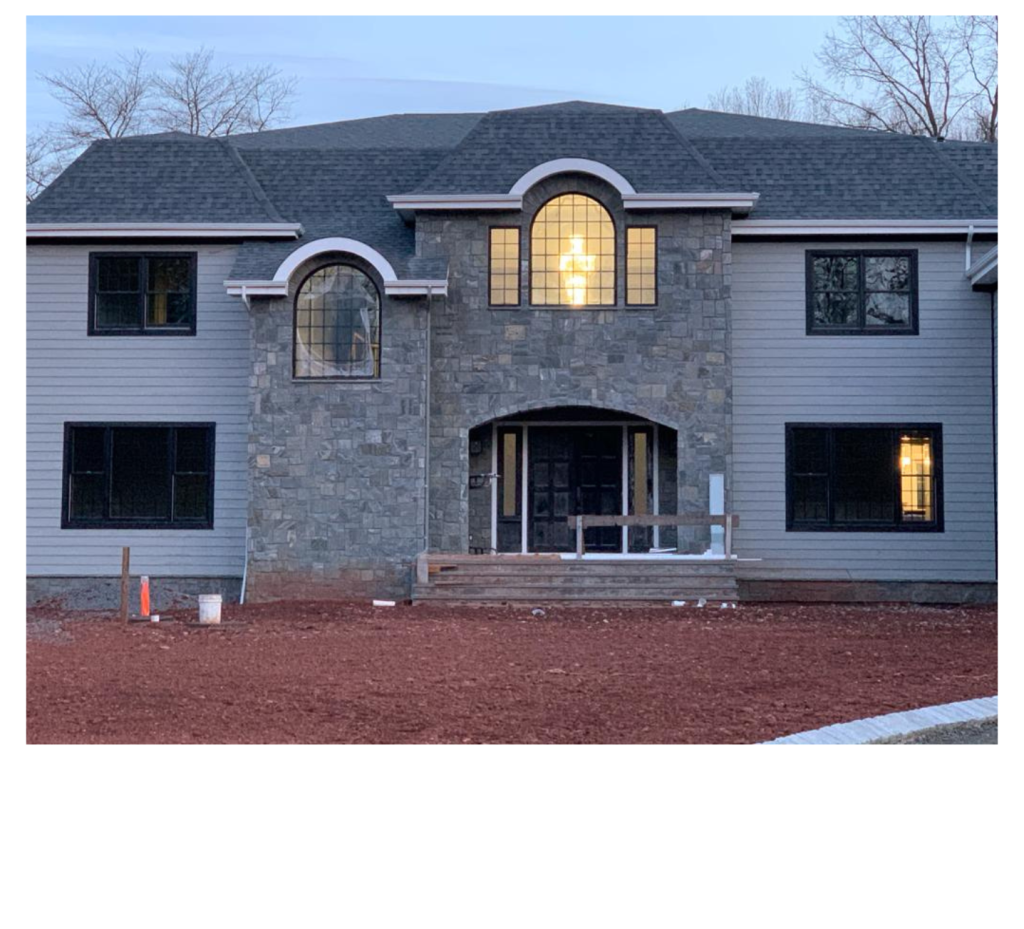 Grand Stone & Arched Windows: An Impressive New Residence