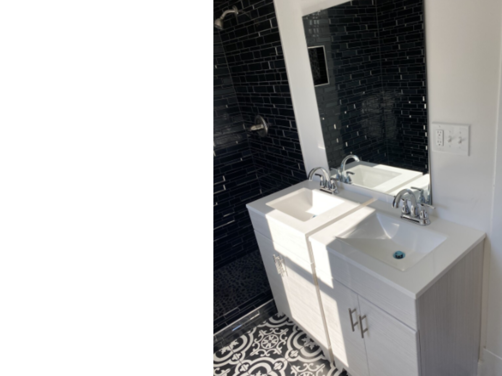 Bold Contrast Bath: Black Tile & Patterned Floor