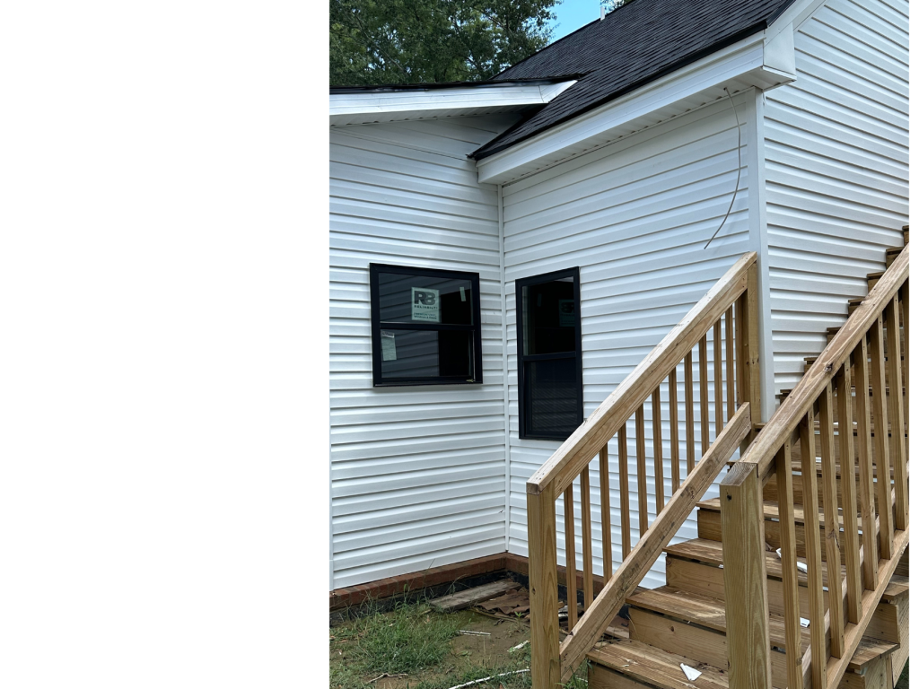 Fresh Exterior Finish: New White Siding & Wood Stairs