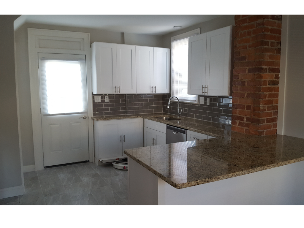 Urban Contrast: White Kitchen with Brick Accent
