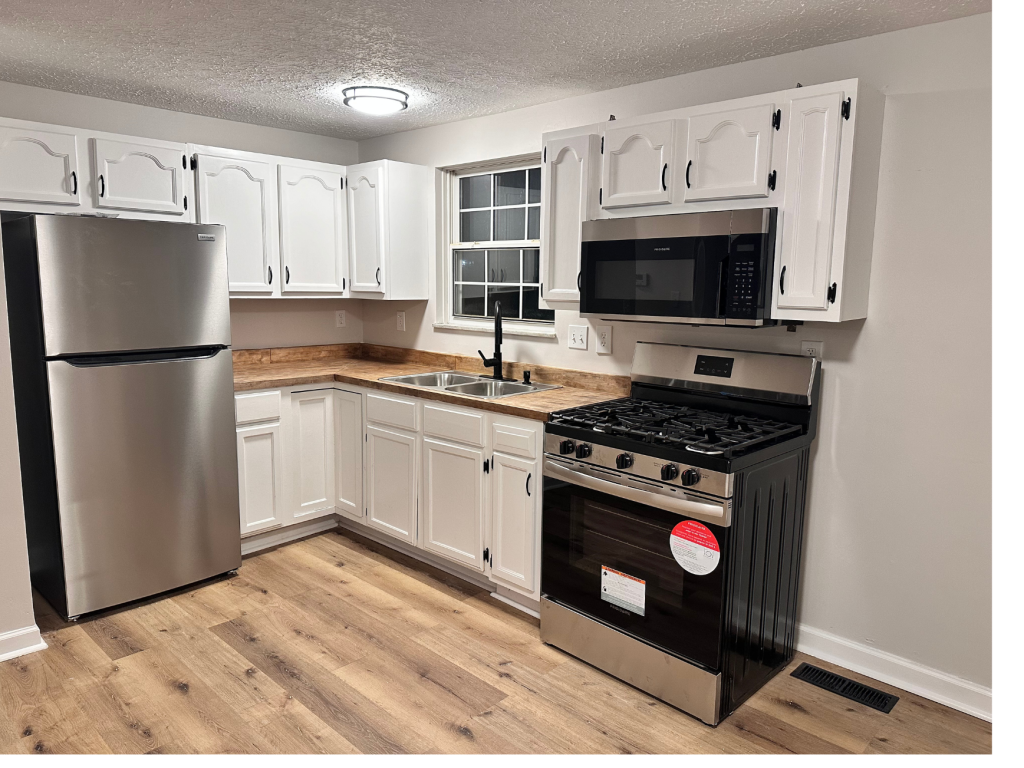 Bright White Kitchen: Modern Black Gas Range Focus