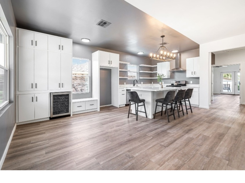 Bright Open Kitchen: White Cabinets & Island Gathering