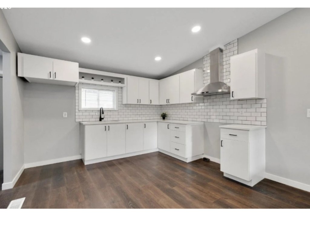 Bright White Kitchen: Bold Dark Wood Floors