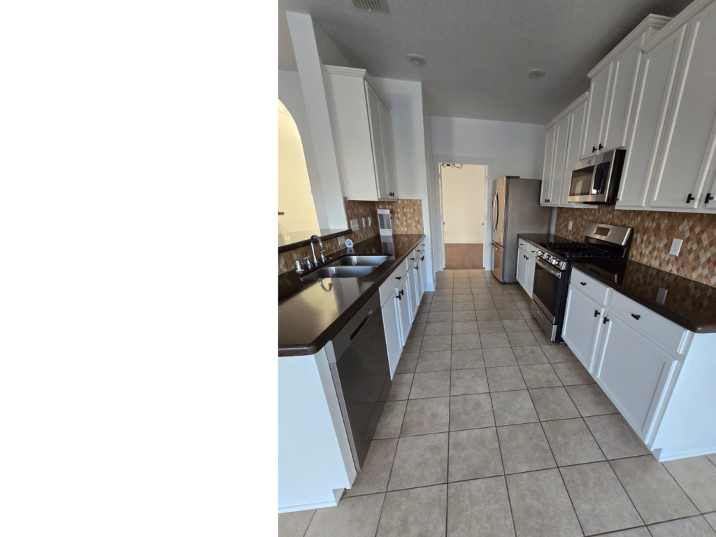 Bright & Spacious Kitchen: White Cabinets & Dark Counters