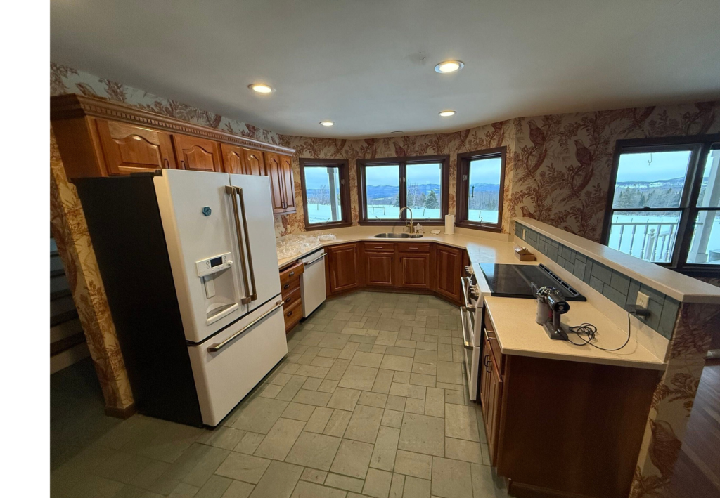Warm & Inviting: A Traditional Kitchen with Rich Wood and Scenic Views