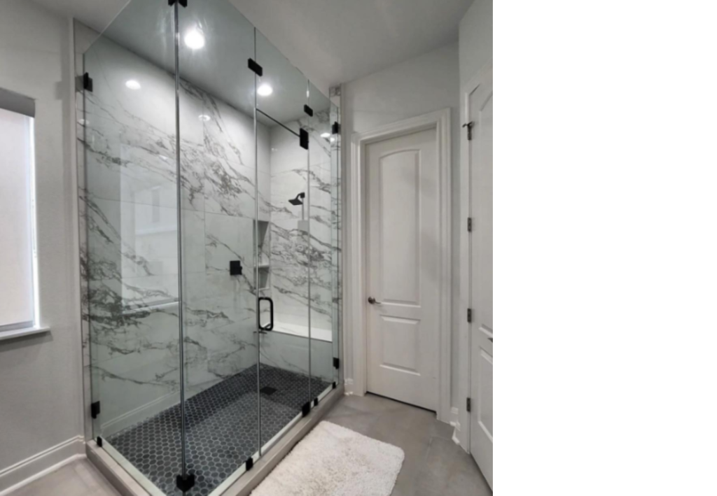 Spa-Like Elegance: Frameless Glass Shower with Marble-Look Walls