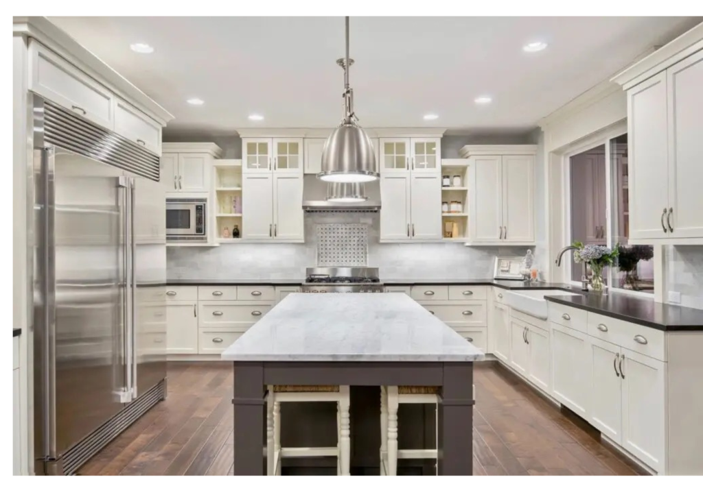 Elegant White Kitchen: Marble Island Focal Point