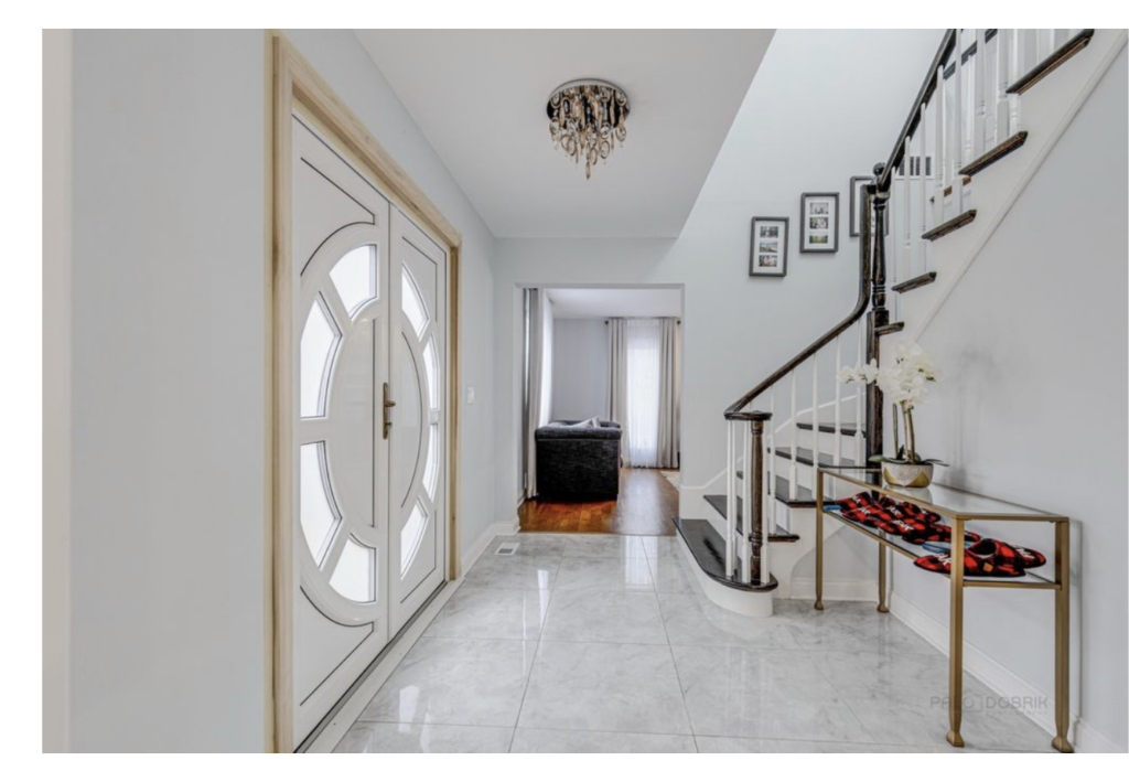Bright Welcome: Elegant Entry with Grand Doors